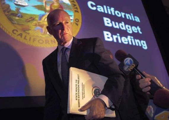 That's not a doctored photo.  Brown leaves a budget briefing carrying a "No on 710" binder.  Photo: (Brian van der Brug / Los Angeles Times / December 14, 2010) via ##http://la.curbed.com/archives/2010/12/doing_his_homework.php##Curbed##