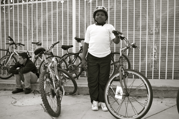 At ease, Soldier: A young member of the East Side Riders proudly poses with his bike at the Watts Towers. Sahra Sulaiman/LA Streetsblog
