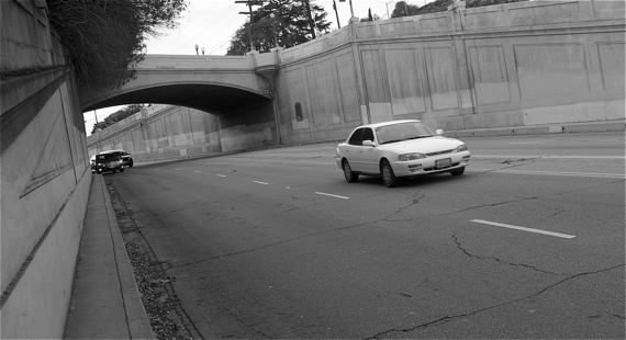 The car at top left was one of several that hugged the curb as they came flying around the curve under Waverly (heading into Atwater). I would have stood closer to the curve so that you could better see the remains of several hubcaps in the gutter, but it felt too dangerous. Sahra Sulaiman/LA Streetsblog