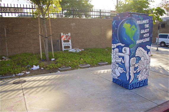 Garbage strewn behind the utility box suggests someone needs to take Blosm's message about pollenating the earth a little more to heart. Sahra Sulaiman/LA Streetsblog