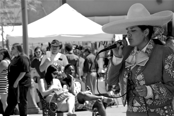 A woman sings boleros at a festival on Mariachi Plaza. Sahra Sulaiman/LA Streetsblog