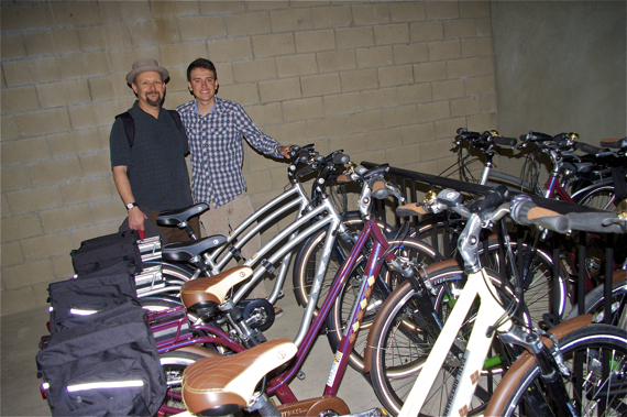 Colin Bogart (LACBC) and Diego Binatena, an Eagle Scout who put together a bikeshare program for two residential facilities for the homeless, stand next to the newly donated bikes at PATH in Hollywood. Sahra Sulaiman/LA Streetsblog