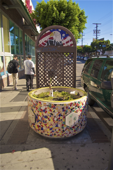 The planter is lovely but, like the wooden screens and random trash cans, oddly placed and could use some upkeep. Sahra Sulaiman/LA Streetsblog
