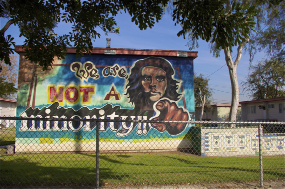 One of the more than 50 murals populating the walls of Estrada Courts in Boyle Heights. Sahra Sulaiman/LA Streetsblog