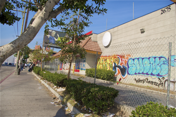 Billboards, graffiti, and trash mar the landscape along sections of Olympic. Sahra Sulaiman/LA Streetsblog