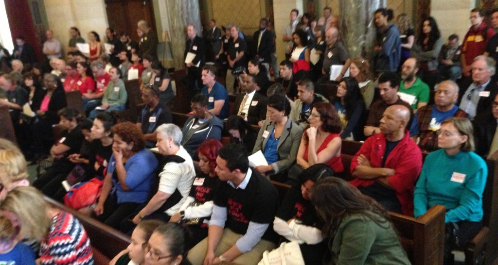 Overflow crowd at yesterday's anti-fracking hearing at the L.A. City Council PLUM Committee. South L.A. residents wearing their black and red People Not Pozos T-shirts in the foreground. Joe Linton/LA Streetsblog