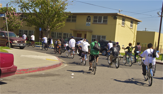 The group rides through Nickerson Downs, a public housing development whose "No Trespassing" signs -- likely posted to help keep residents safe -- also ensure that residents remain isolated. Sahra Sulaiman/LA Streetsblog
