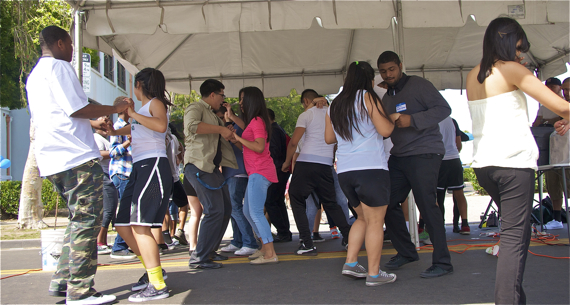 Students from Augustus Hawkins dance at the grand re-opening of Alba Snacks & Services. Sahra Sulaiman/LA Streetsblog