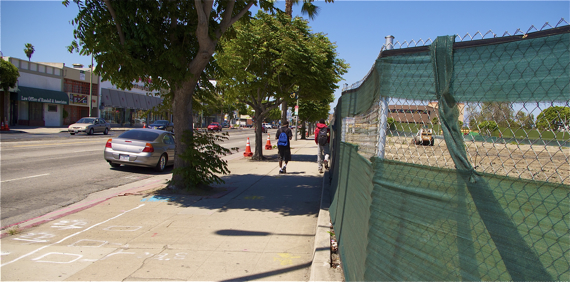 Youth walk home after school along the District Square site on Crenshaw Blvd. Sahra Sulaiman/LA Streetsblog