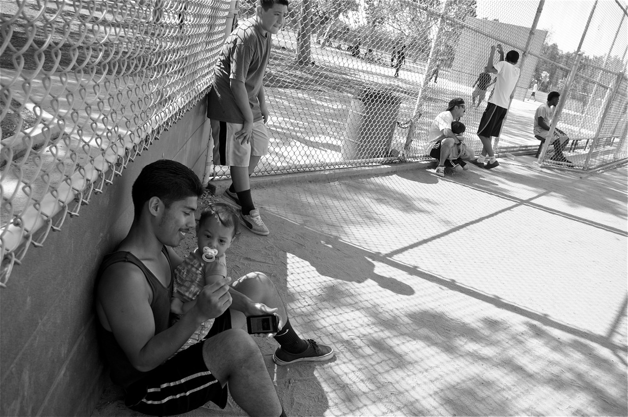 Jimmy and his daughter take a break from the kickball game. Sahra Sulaiman/LA Streetsblog