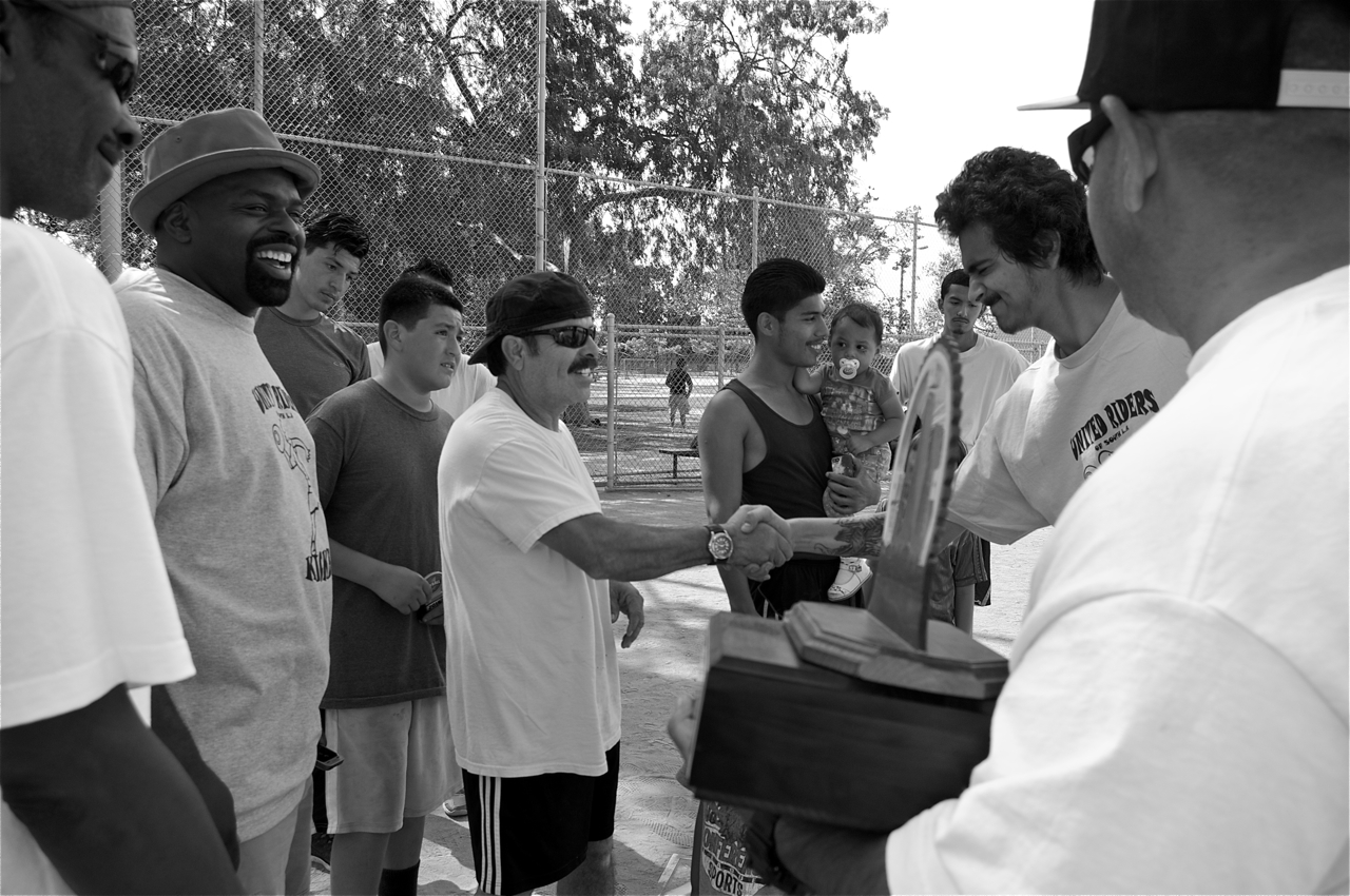 The Woodshop Boys' coach is congratulated on their victory. JP (at right) holds the trophy he made himself. Sahra Sulaiman/LA Streetsblog