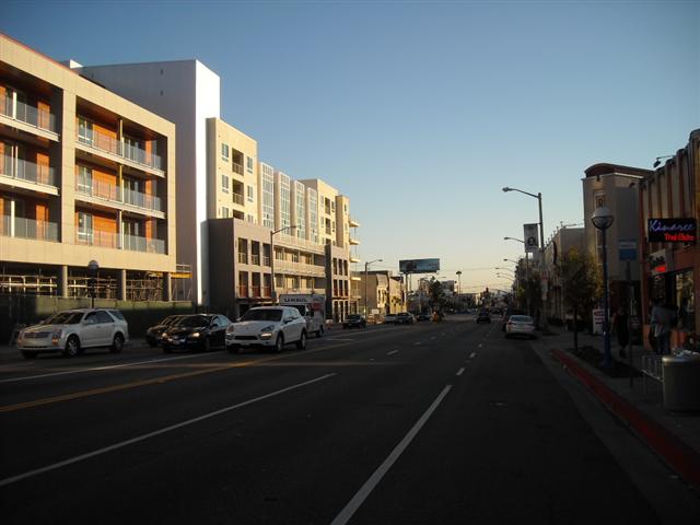 La Brea Avenue southbound. just south of Fountain Avenue: Thanks to the new mixed-use project,  the street looks more inviting. However, center-median is barely  visible, and sidewalks have not been  widened by the City of WeHo.