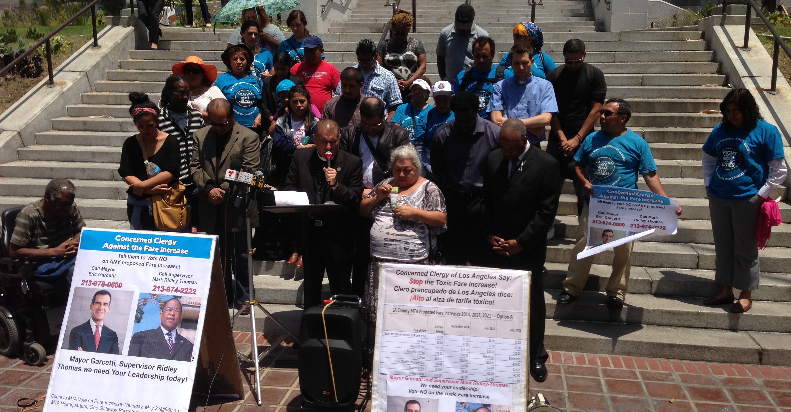 Bishop Juan Carlos Mendez, of Churches for Action, prays for Metro board officials to  have hearts of compassion in opposition to Metro's proposed fare increase. Photo: Joe Linton/Streetsblog LA