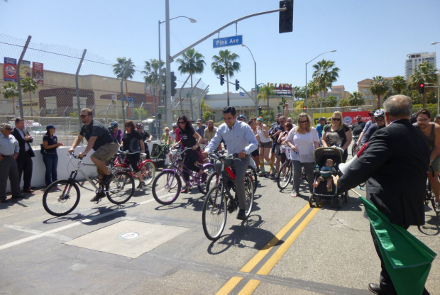Long Beach may not have a ciclovia style open street event, but Vice-Mayor Robert Garcia is front and center when the Long Beach Grand Prix allows cyclists to use its closed course the day before the race. Image: ##http://lbpost.com/news/2000003501-the-return-of-the-grand-prix-ciclovia-of-long-beach#.U2Qmr61dUs0##Long Beach Post##