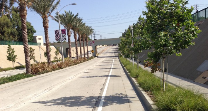 Heading southbound toward the railroad underpass at the southern end of Temple City. Extensive landscaping and curb-bike-lanes.