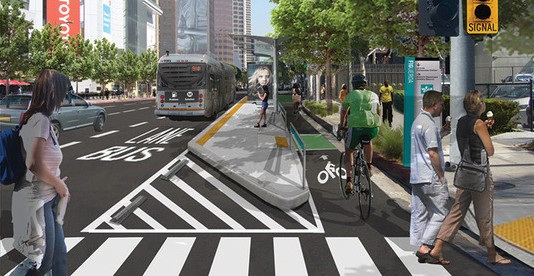This rendering of the MyFigueroa project shows how protected bike lanes help prevent bus-bike conflict.