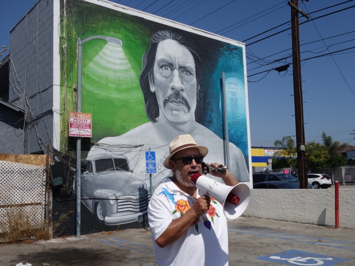 Artist Manny Velazquez shares the story behind the Danny Trejo mural in Pacoima. Photo Erick Huerta