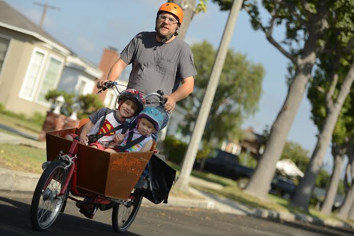 A few things have changed since we started, but my kids still prefer a trip by bicycle. Photo: Will Kirk/##homewoodphoto.jhu.edu##Homewood Photographic Services##