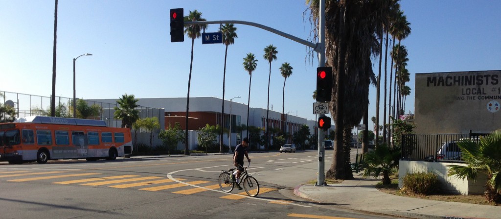 Bike lanes do not solve all of Wilmington's problems, but they can be one step in a healthier direction. Cyclist crossing Avalon Boulevard in Wilmington.