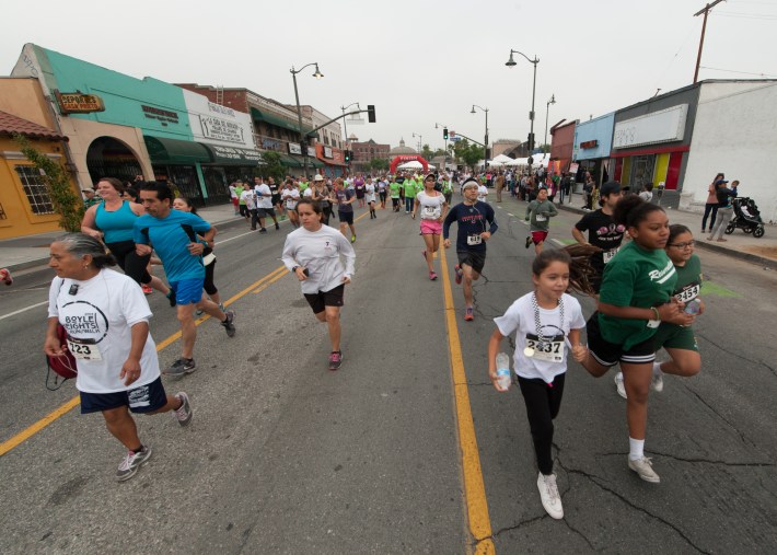 And they're off! Runners make their way down 1st St. in Boyle Heights. Photo: Eddie Ruvalcaba