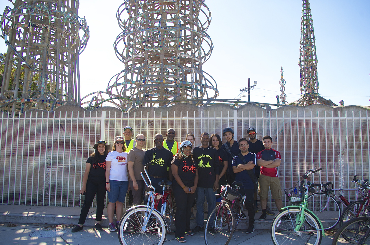 PELA members and members of the East Side Riders gather at the Watts Towers. Sahra Sulaiman/Streetsblog L.A.