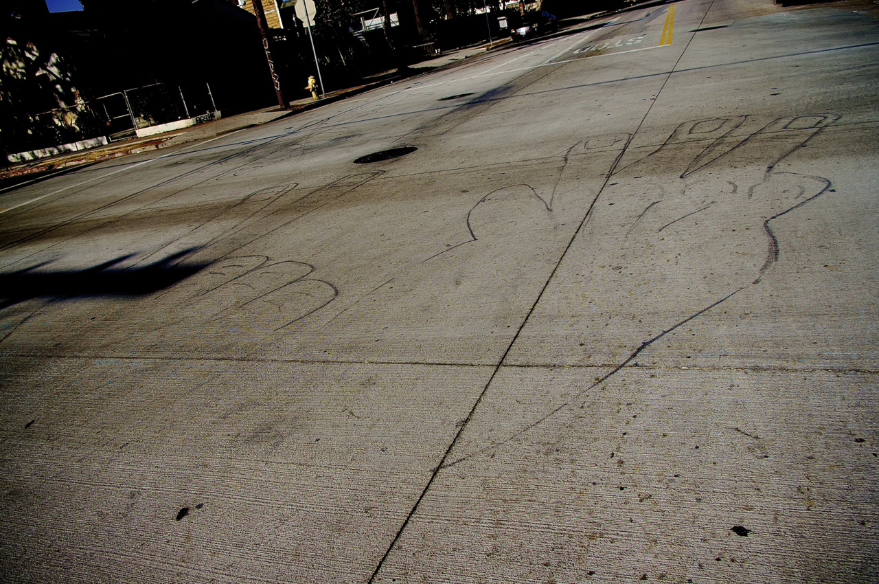Fingers painted on the street call out "23." Sahra Sulaiman/Streetsblog L.A.