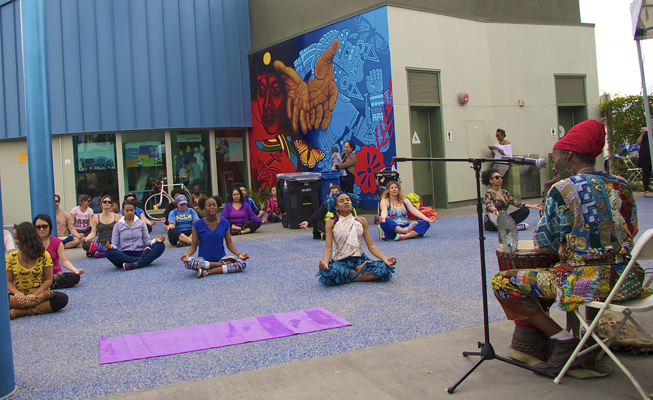 An African dance workshop by the Anani Cultural Center at the CD 9 Constituent Center begins with some yoga stretches and a calming flute melody. Sahra Sulaiman/Streetsblog L.A.