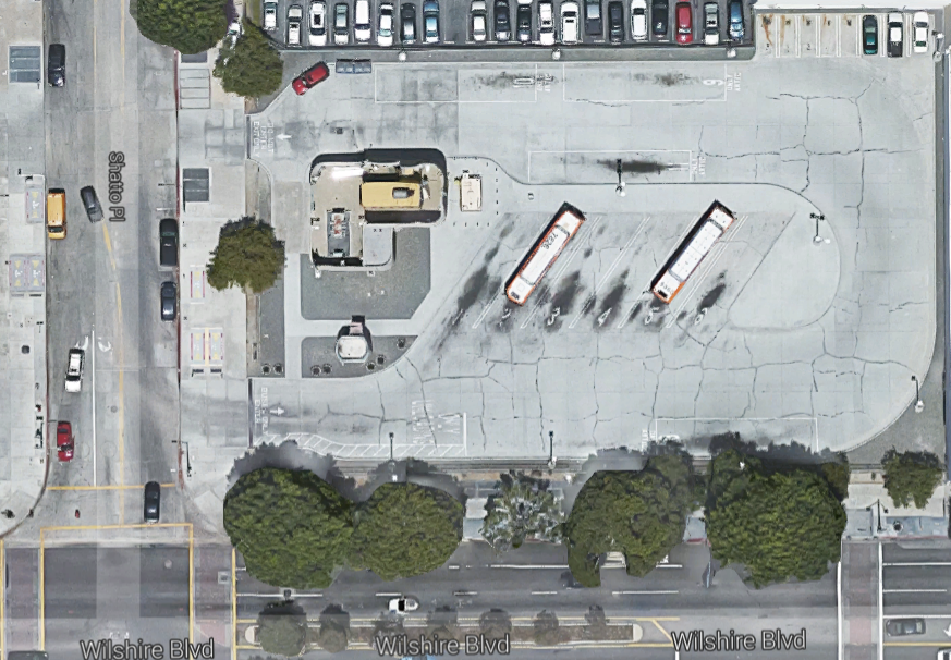 Metro should pursue joint development beyond the five rail lines under construction, including sites like this bus parking on Wilshire Boulvard just east of the Vermont/Wilshire station. Image via Google maps