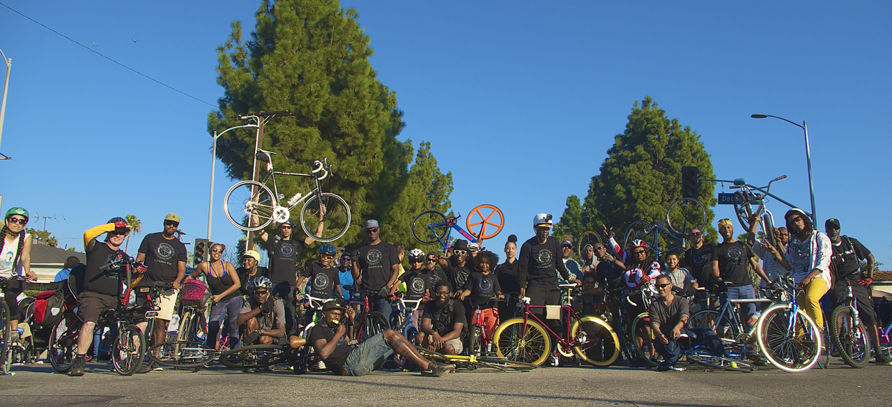 Members of the Black Kids on Bikes and their supporters gather for a photo during the MLK Day Parade along King Blvd. Sahra Sulaiman/Streetsblog L.A.