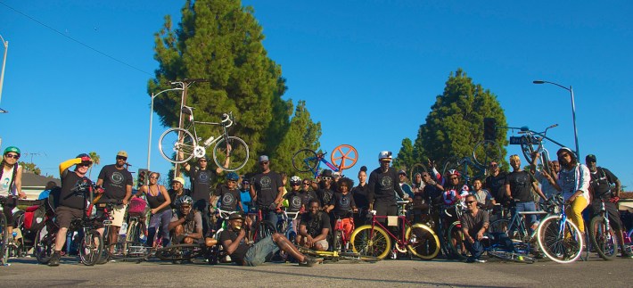 Members of the Black Kids on Bikes and their supporters gather for a photo during the MLK Day Parade along King Blvd. Sahra Sulaiman/Streetsblog L.A.