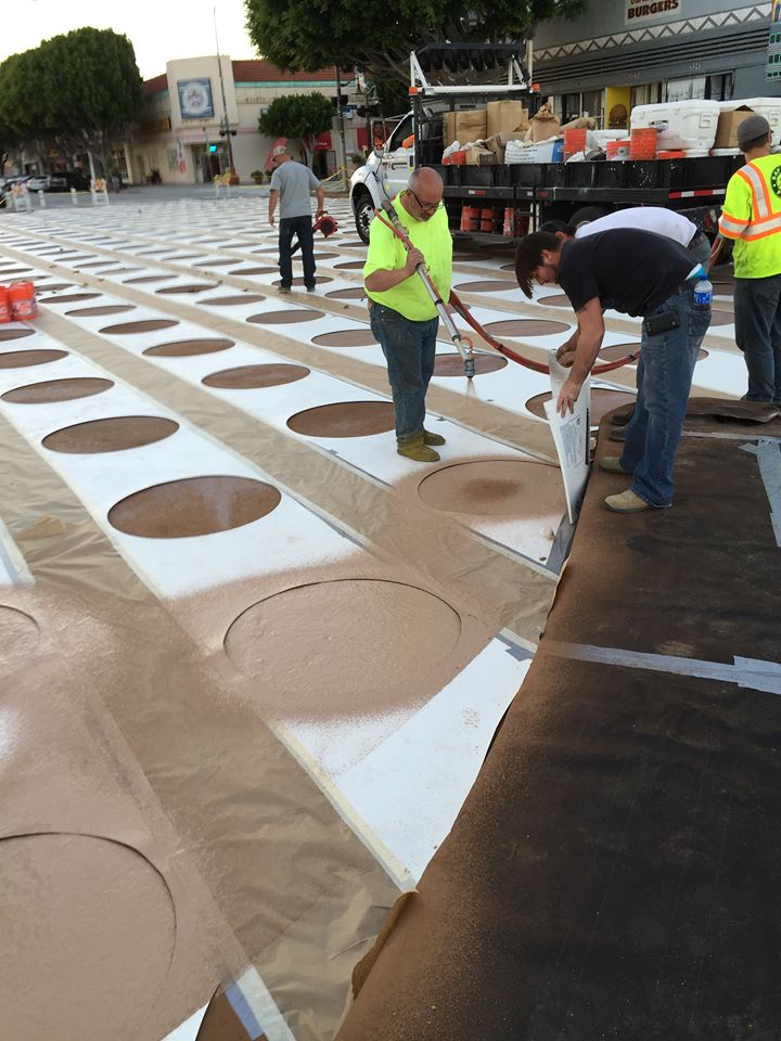 LADOT crews painting the new plaza at Leimert Park last week. Photo by Kathleen Smith