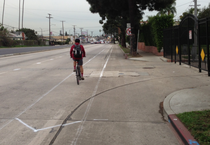 Existing eastbound bike lanes on Venice Boulevard (pictured here at Wellington Road) are being upgraded to buffered bike lanes.