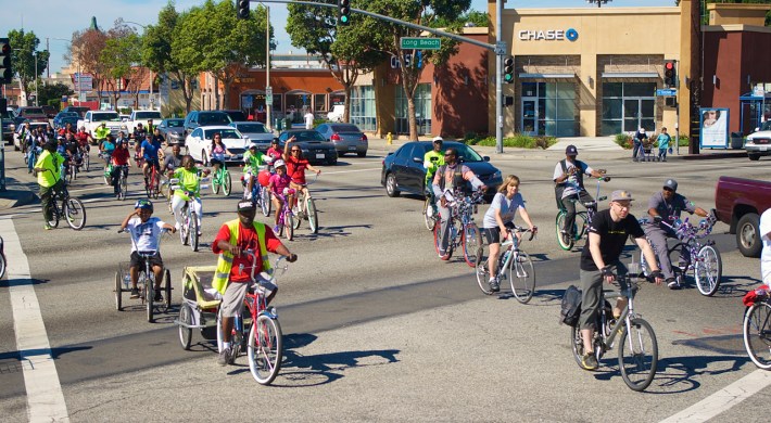The tail end of the group heads into South Gate along Firestone Blvd. Sahra Sulaiman/Streetsblog L.A.