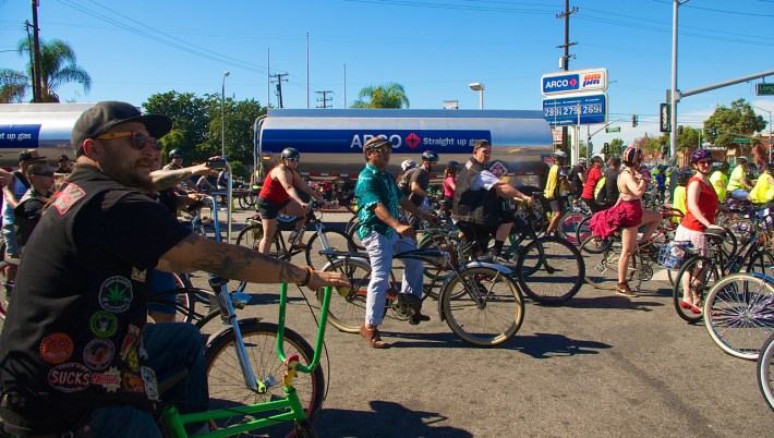 Riders make way for a delivery of gasoline to the am/pm station. Sahra Sulaiman/Streetsblog L.A.