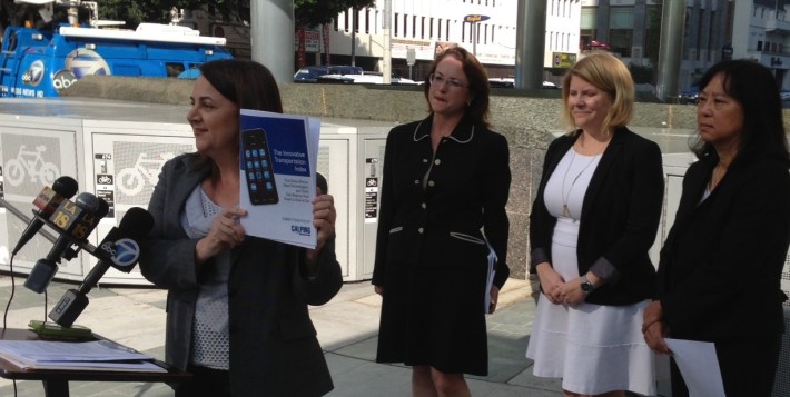 CALPIRG's Diane Forte (left) showcases The Innovative Transportation Index report at this morning's press event. Behind her are Hilary Norton, Seleta Reynolds, and Lindy Lee. Photo: Joe Linton/Streetsblog L.A.