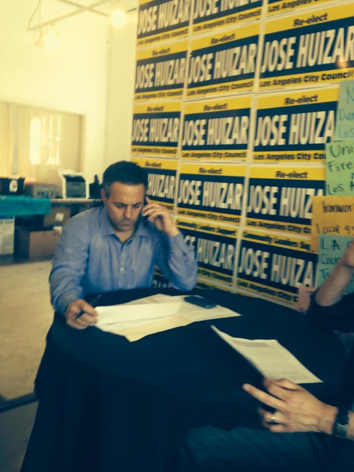 Joe Buscaino, who received more votes in his Streetsie race against Huizar than Molina did in her City Council race, works the phone lines yesterday.
