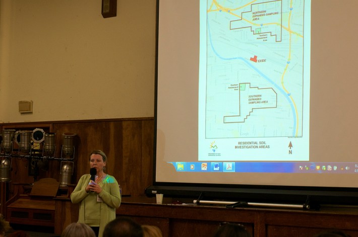 DTSC Director Barbara Lee stands beneath the map of the two assessment areas (the two green squares deemed most likely to have been affected by lead emissions) and the expanded assessment areas, where current sampling for lead contamination was currently underway (areas outlined in black). Sahra Sulaiman/Streetsblog L.A.