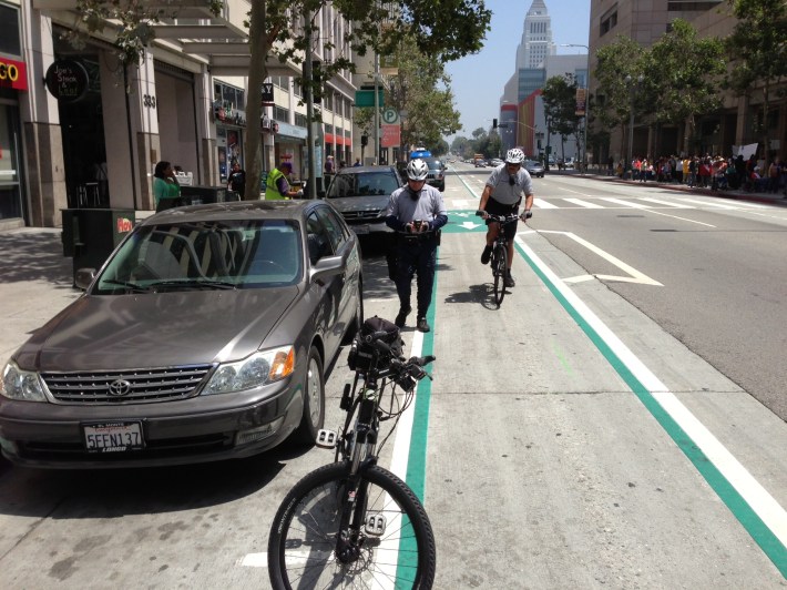 Officer Guerra and Sgt. Smith ticketing a parking violation on Spring Street. All photos by Joe Linton/Streetsblog L.A.