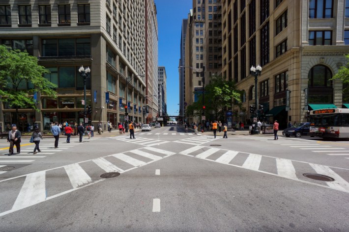 Chicago's first pedestrian scramble, or "Barnes Dance", at the downtown intersection of Jackson Blvd. and State St. Pedestrians are allowed to cross all directions, including diagonally, every three light cycles. All vehicular turns have been prohibited to improve traffic flow. Photo: Chicago's first pedestrian scramble, or "Barnes Dance", at the downtown intersection of Jackson Blvd. and State St. Pedestrians are allowed to cross all directions, including diagonally, every three light cycles. All vehicular turns have been prohibited to improve traffic flow. KEVIN ZOLKIEWICZ/FLICKR via ##http://www.scpr.org/programs/airtalk/2014/11/03/40143/los-angeles-ponders-diagonal-crosswalks-what-are-t/##Airtalk/KPCC##