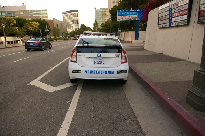 A parking enforcement vehicle occupies the southbound bike lane on Los Angeles St. in July. Sahra Sulaiman/Streetsblog L.A.