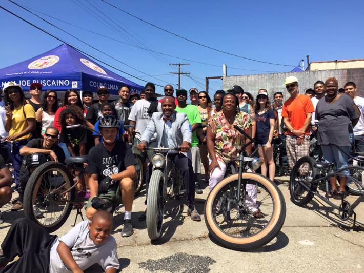 Supporters gather for a photo after touring the community. Photo courtesy of the East Side Riders.