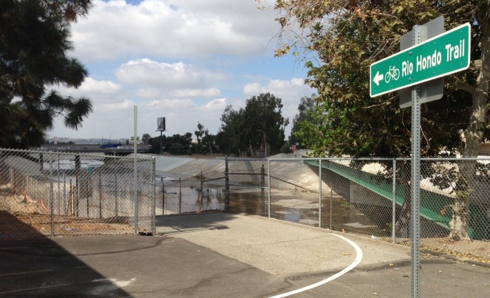 For years, the connection to the Rio Hondo bike/walk trail was fenced off. It's now open, and has directional signage to