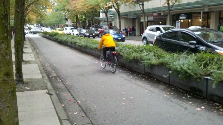 A planter protected bikeway in Downtown Vancouver is wide enough for a fire truck.
