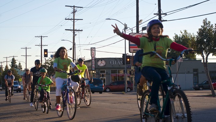 Community members that regularly commute by bike ride toward Councilmember Curren Price's office to deliver a letter asking him to support a bike lane along Central Avenue. Sahra Sulaiman/Streetsblog L.A.