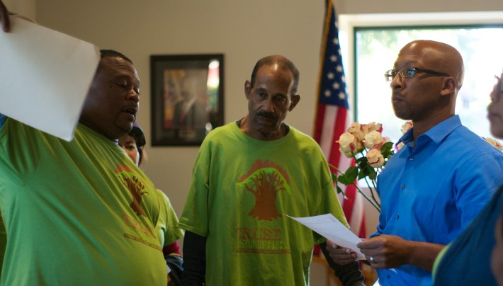 Residents hand their letter to James Westbrooks, District Director. Sahra Sulaiman/Streetsblog L.A.