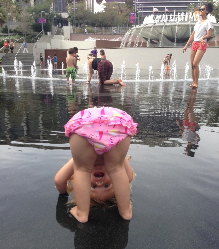 Maeve will probably some day kill me for including this shot of her getting her hair wet at Grand Park.