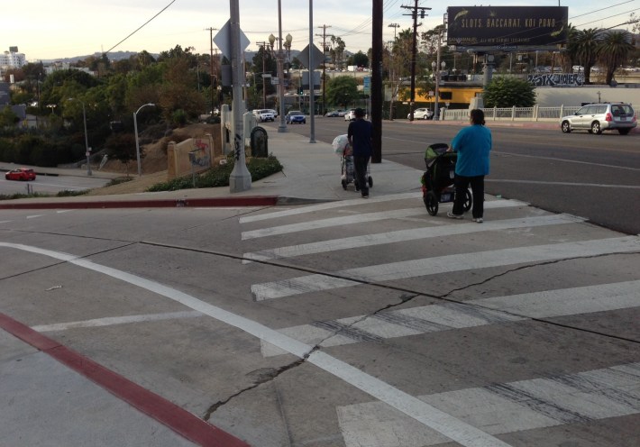 View east today on Temple Street at the "on-ramp" from Silver Lake Boulevard. Drivers still whip around this no-stop turn, though the pedestrian crossing distance has been shortened.