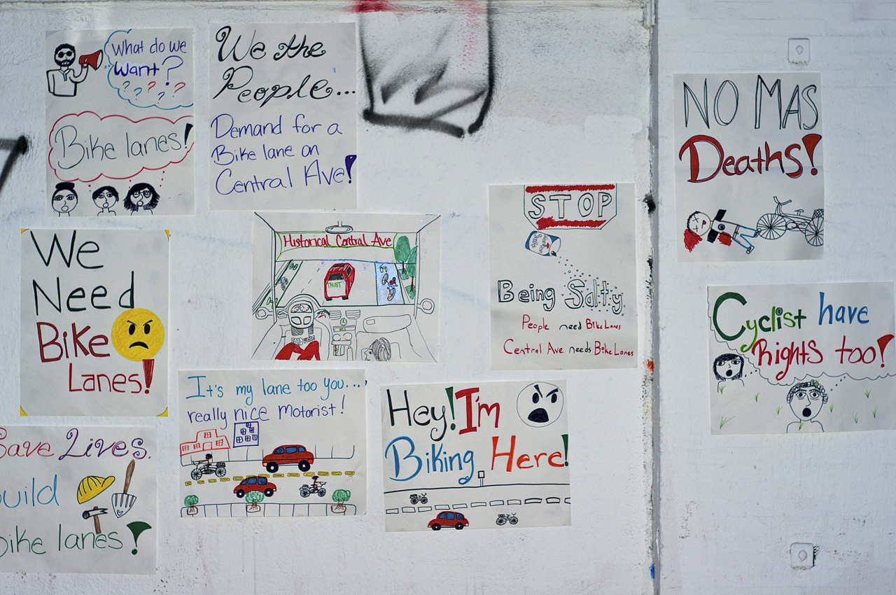 Posters created by South L.A. community members adorn the walls outside of TRUST South L.A. Sahra Sulaiman/Streetsblog L.A.