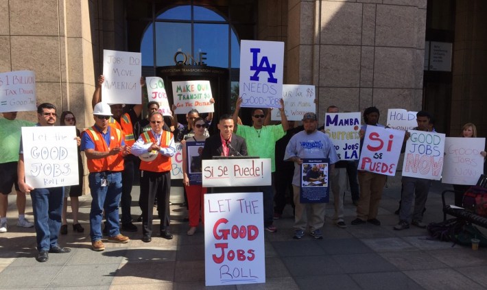 Jobs to Move America organizer Diego Janacua speaks at this morning's rally. Photo: Joe Linton/Streetsblog L.A.