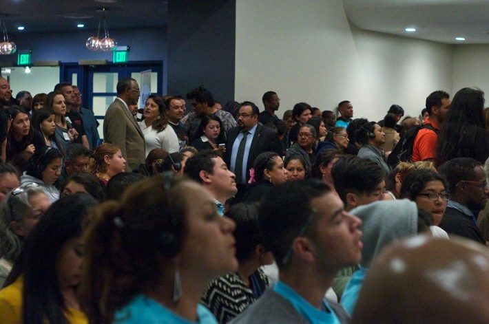 Ninth District Councilmember Curren Price (standing center left, brownish jacket) turned the packed-to-the-hilt town hall over to union representatives and representatives of the "creative habitat" known as the Reef after his opening remarks. Sahra Sulaiman/Streetsblog L.A.